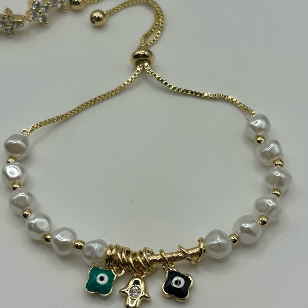Chic Gold and White Bracelet with Charms